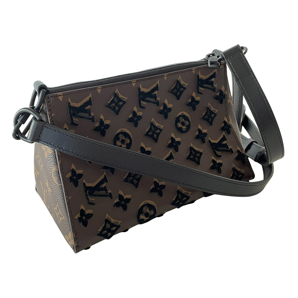 A LIMITED EDITION BLACK MONOGRAM TUFFETAGE TRIANGLE MESSENGER BAG, LOUIS  VUITTON, 2020