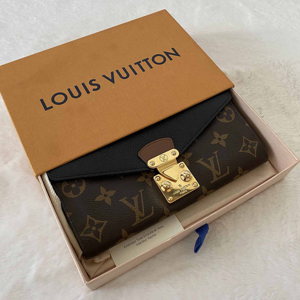 Shop authentic Louis Vuitton Monogram Noir Pallas Wallet at